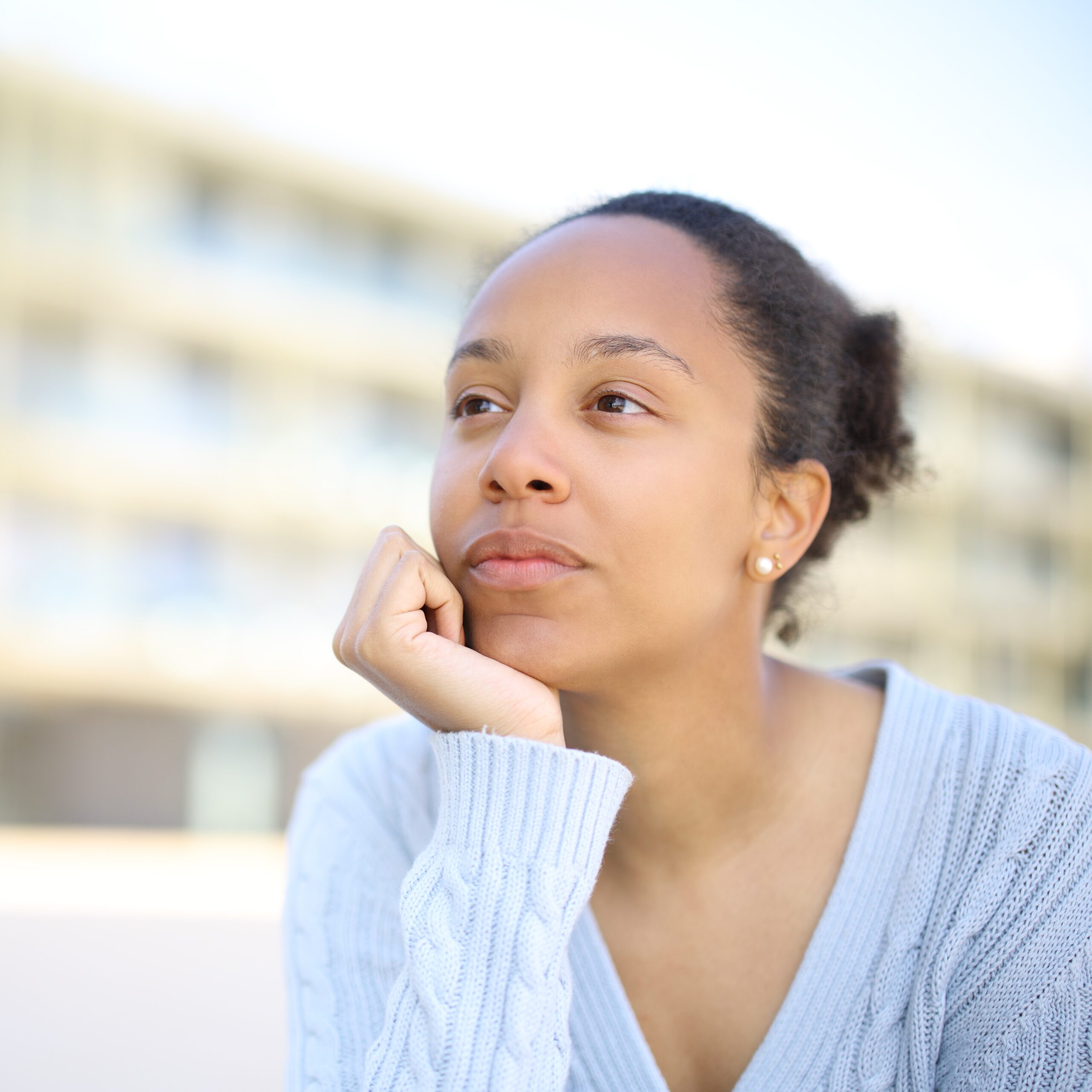A woman wondering "How Much Does the Treatment Cost?"